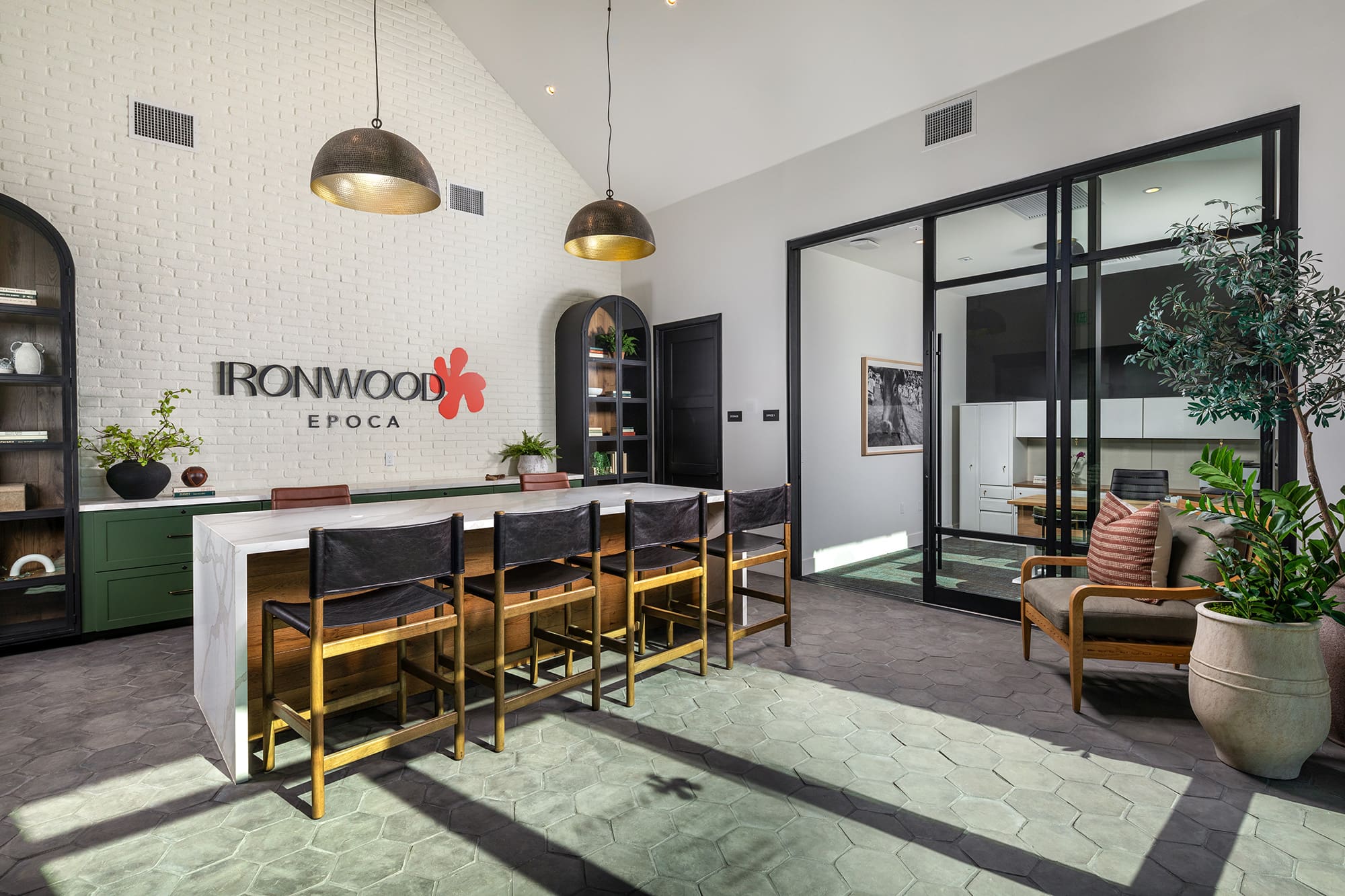 Resident lounge and lobby at the Ironwood apartments in San Diego, featuring counter seating and modern decor.